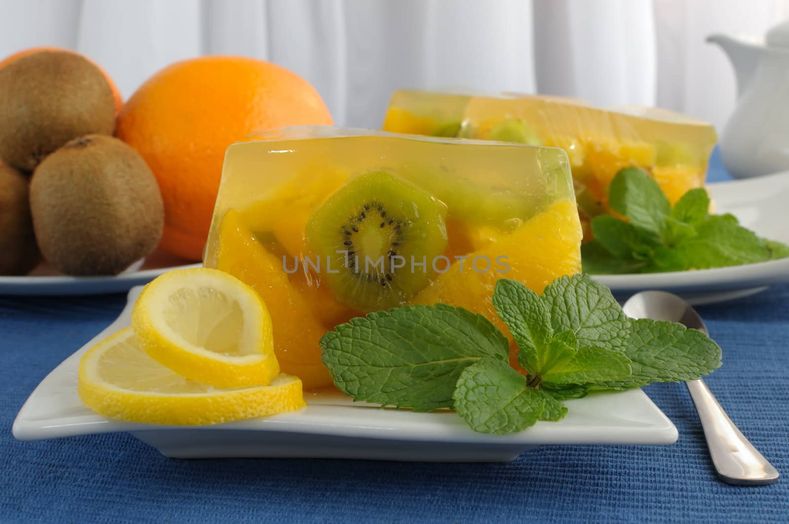 With a variety of fruit jelly with mint close up