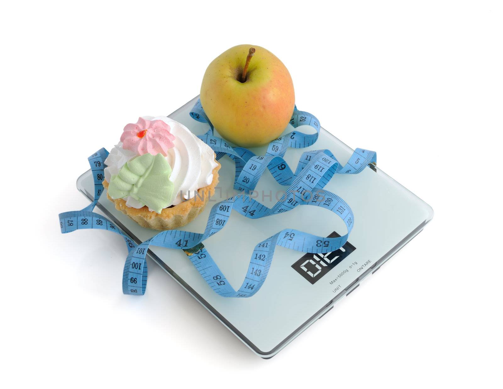 The dilemma of cake or an apple wrapped in the centimeter scale on white background 