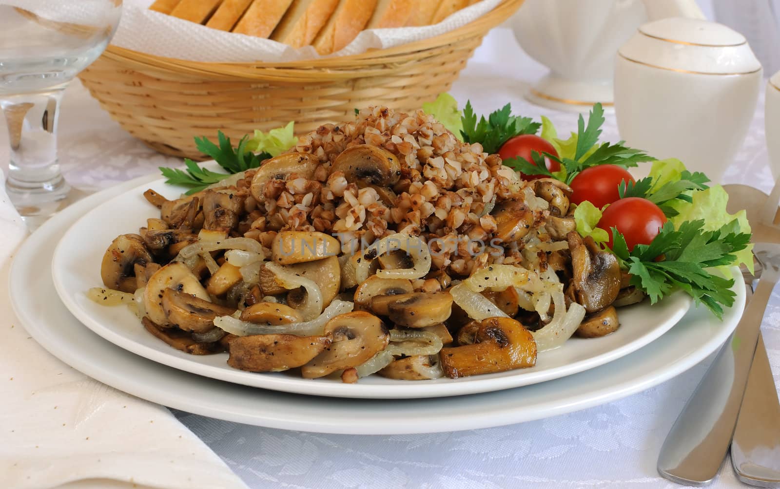 Buckwheat porridge with mushrooms and onions on the dining table