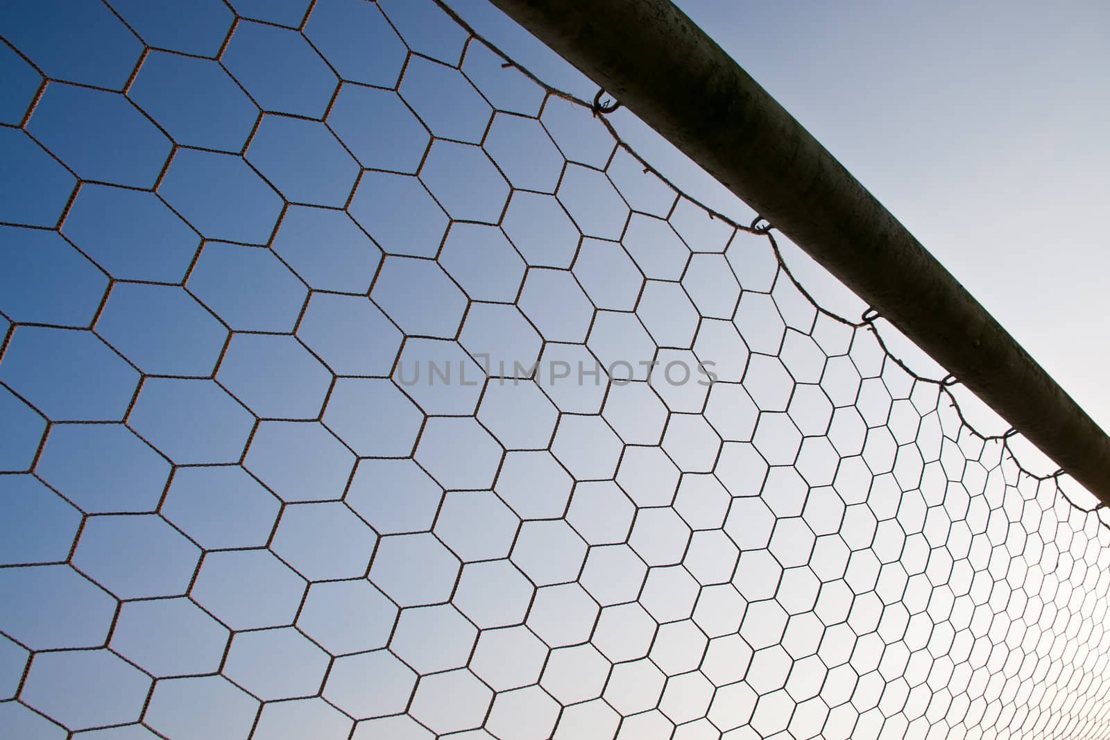 Soccer net with on blue sky background