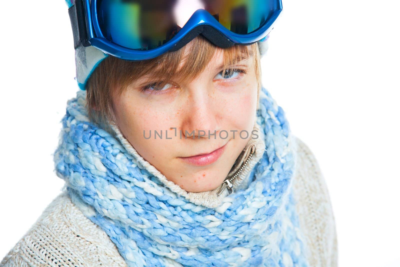 Clouse up portrait of a caucasian cute teenager in ski goggles and a scarf, isolated on white