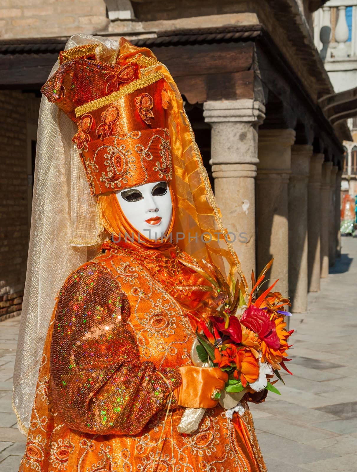 VENICE: An unidentified masked person in costume in St. Mark's Square during the Carnival of Venice, 2010.