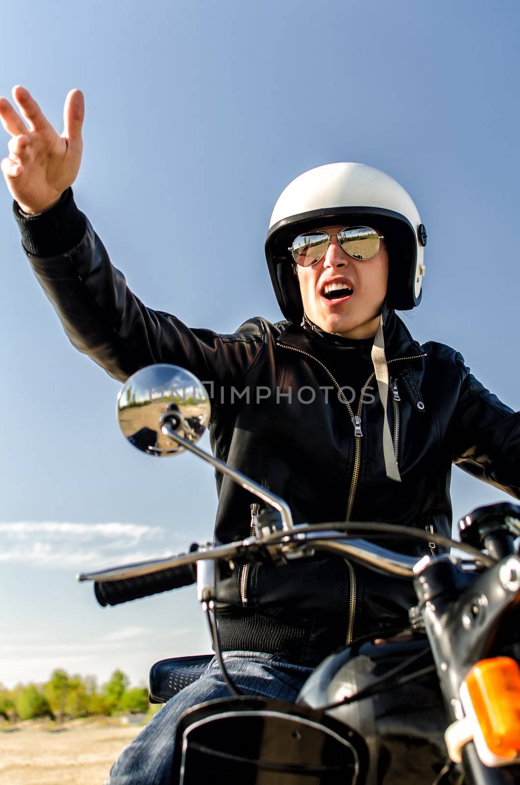 Motorcycle cop in a helmet and goggles by dmitrimaruta