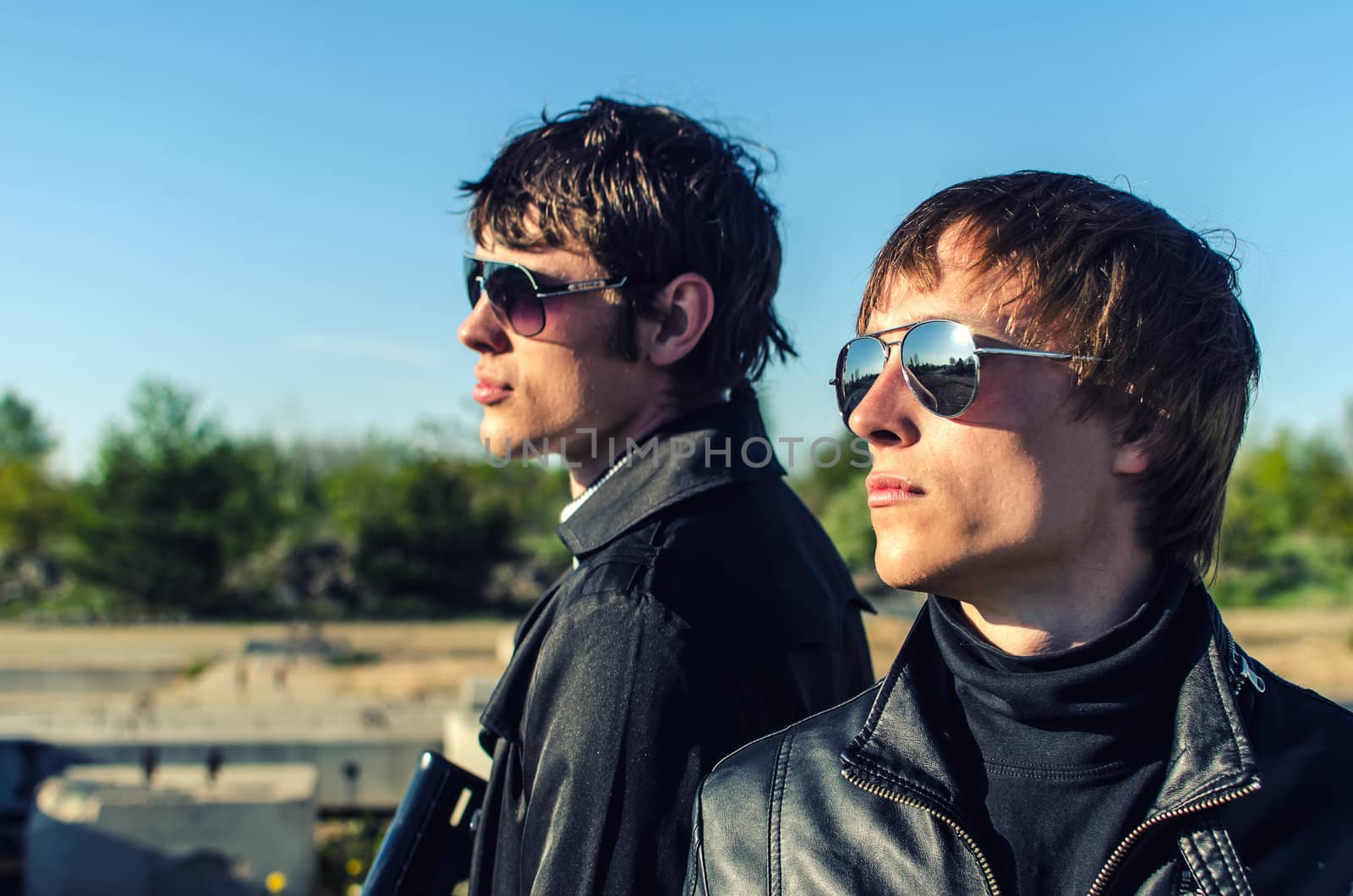 Portrait of two tough guys in glasses