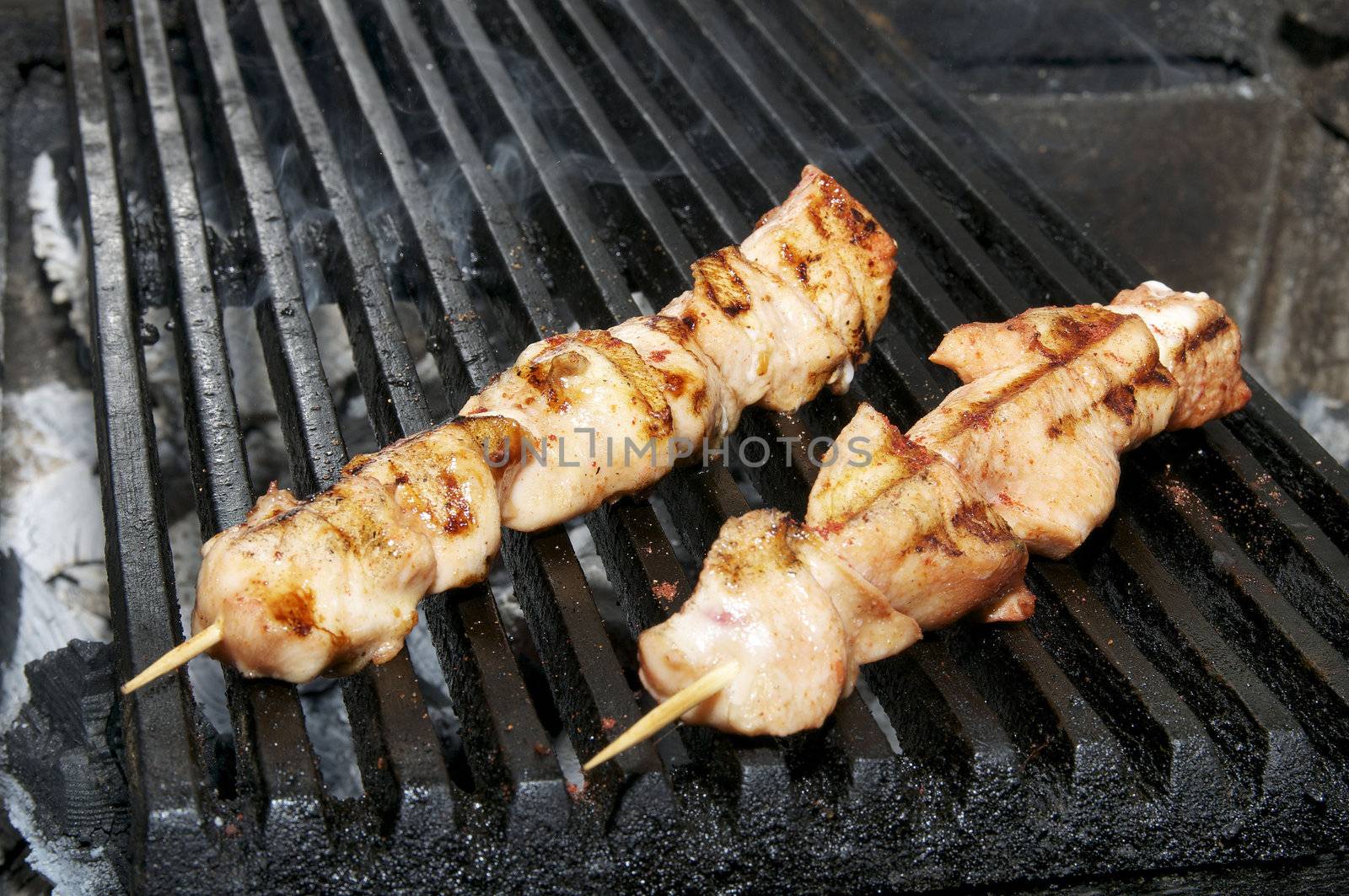 Chicken kebabs on the grill in the restaurant