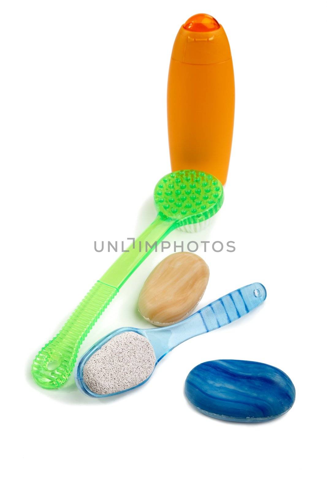 Washed shampoo and brushes on a white background