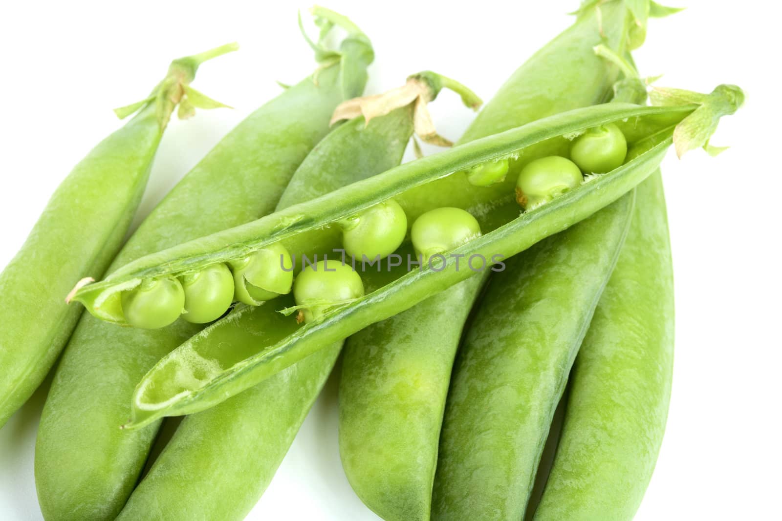 fresh peas isolated on white background