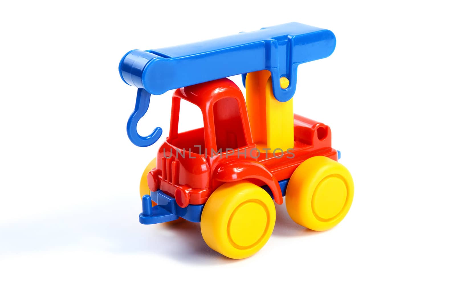Children's toy the car-crane isolated on a white background