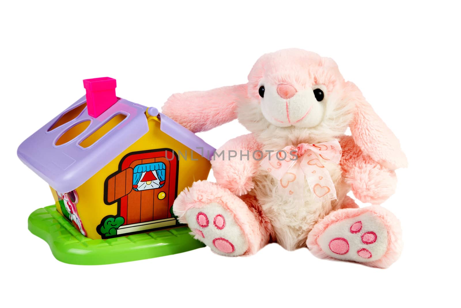Soft toy and small house isolated on a white background