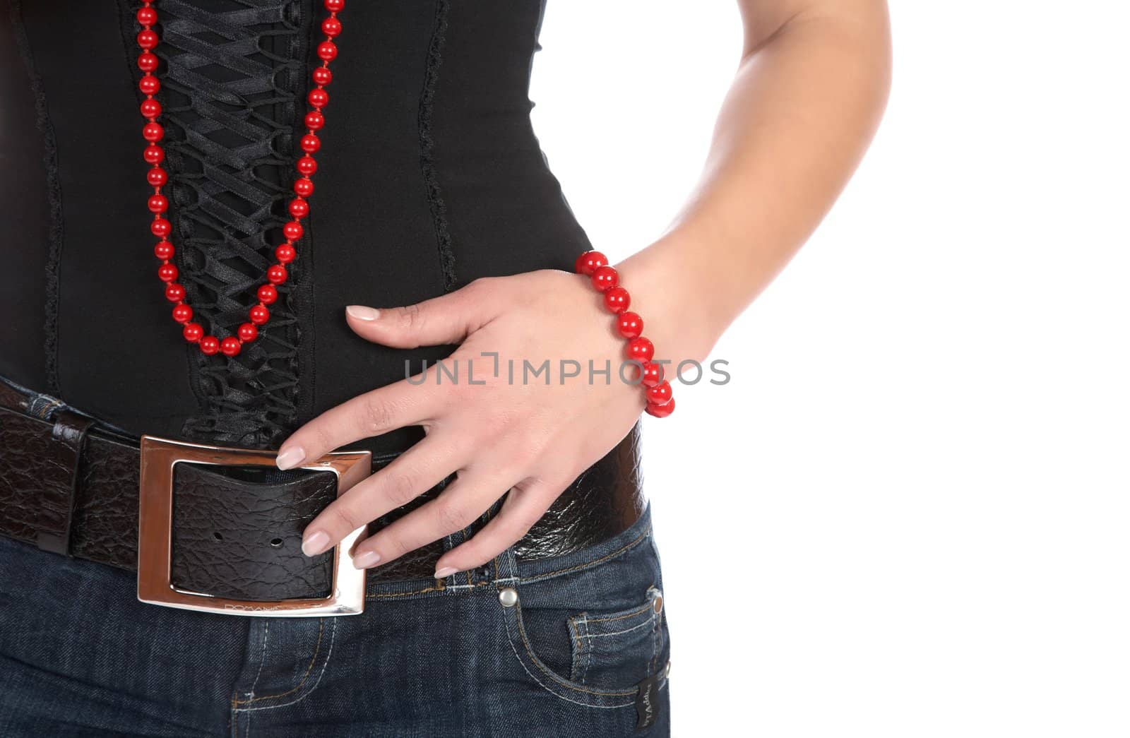 Torso and hand of the girl with adornment on a white background