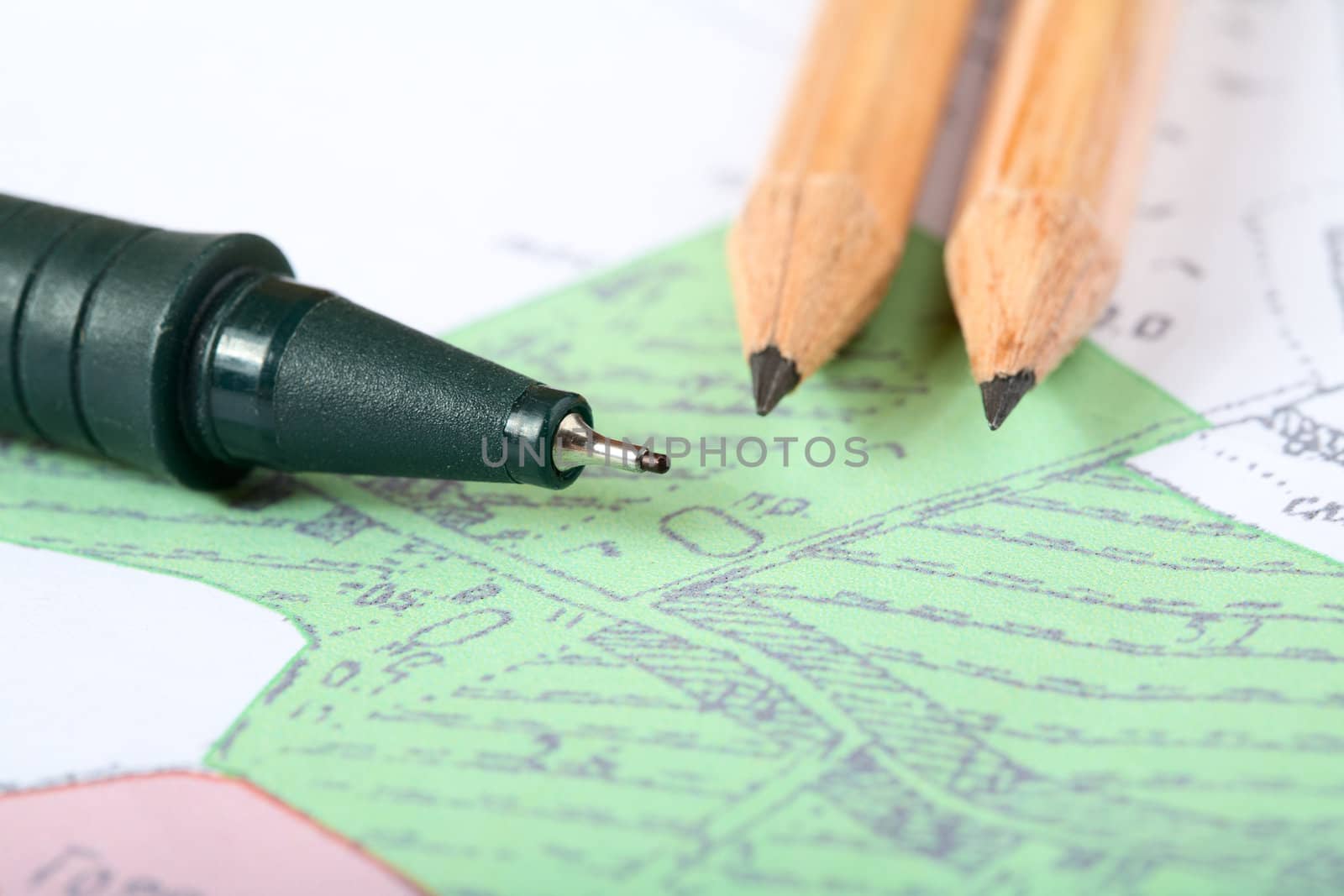 Pencils and marker on a topographic map