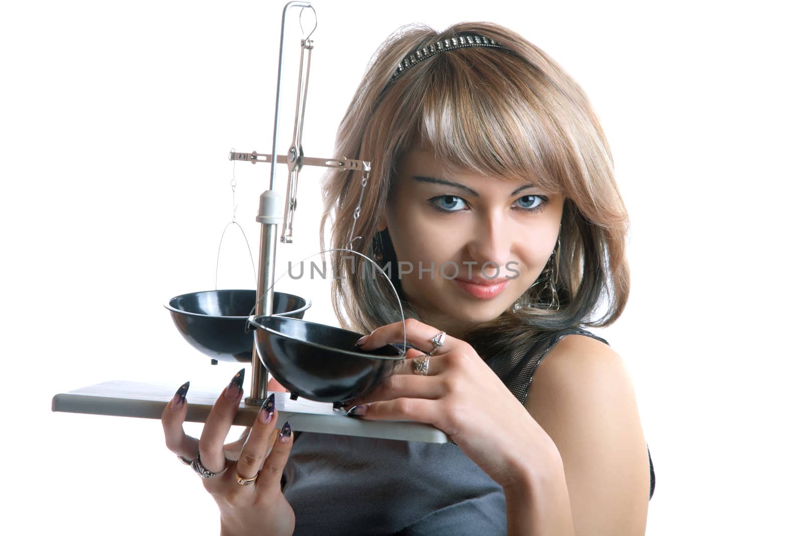 The girl with pharmaceutical scales in hands isolated