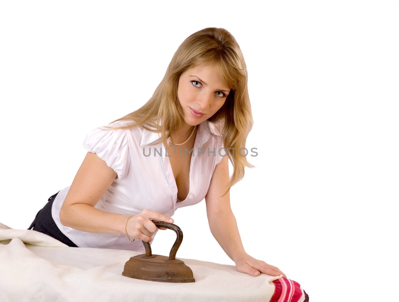 The girl irons an old iron on a white background