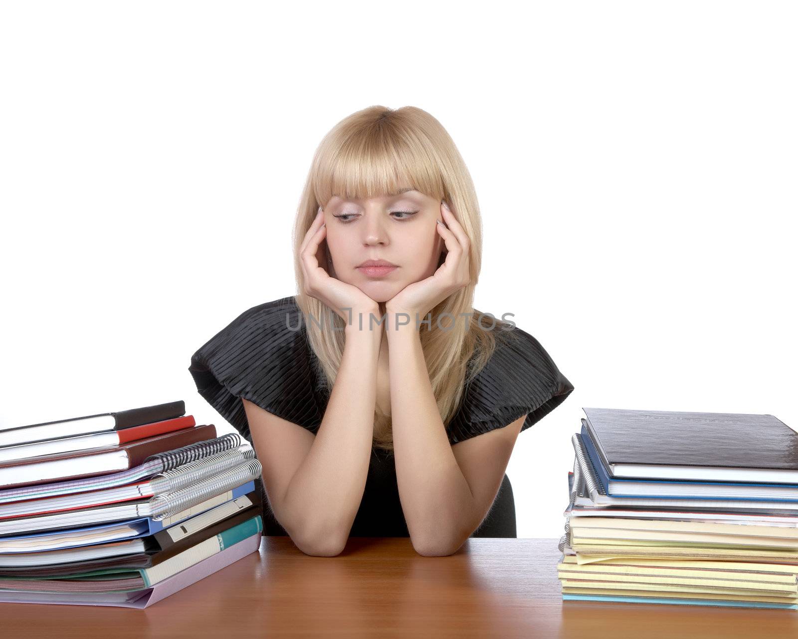 girl with two piles of writing-books and notebooks on a white background