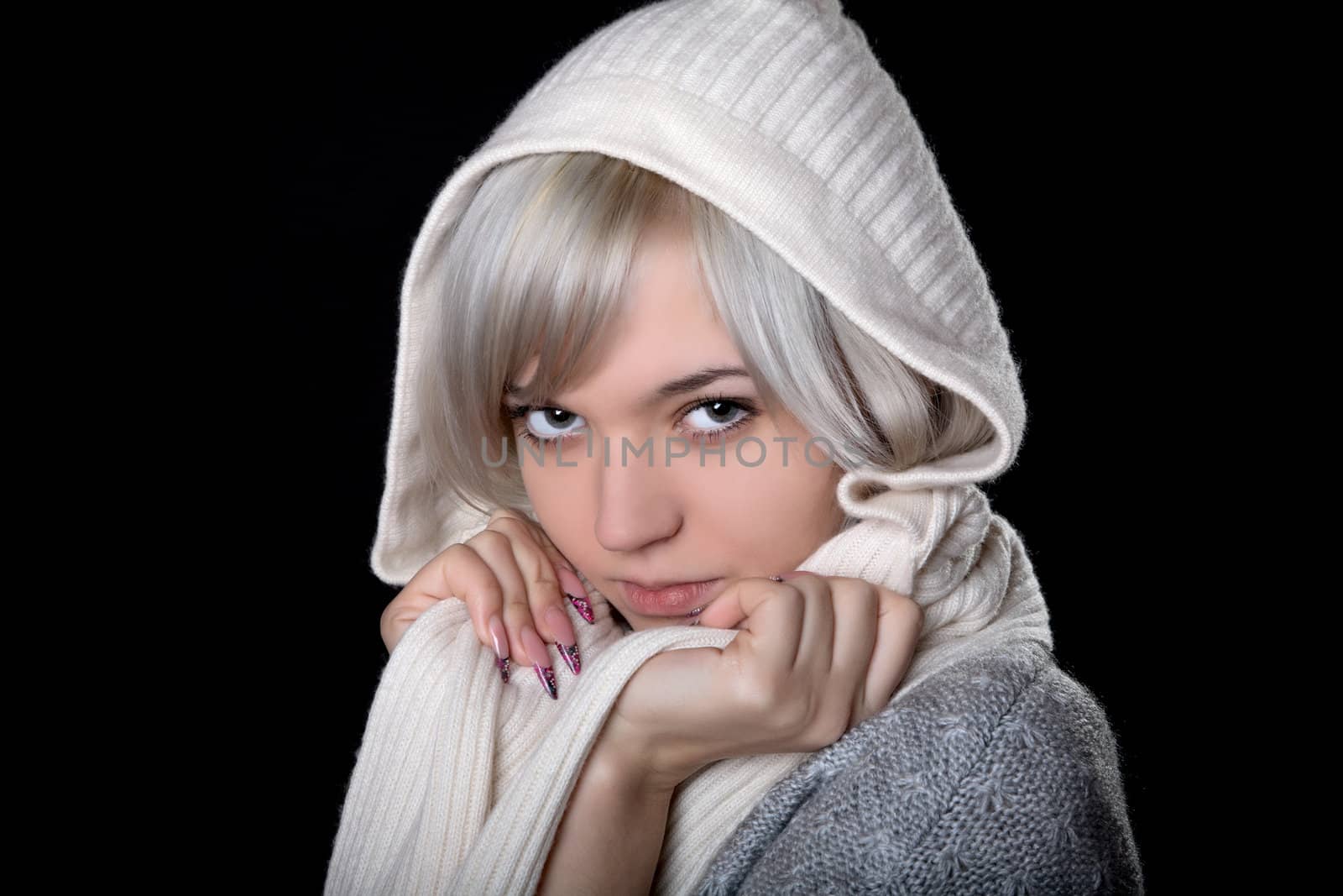 The girl in  white hood on a black background