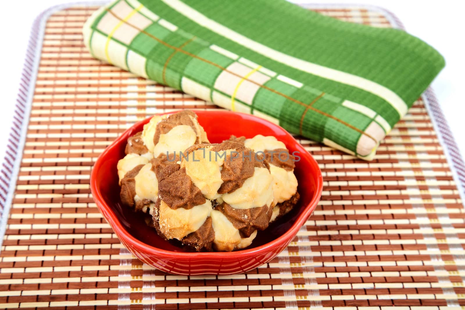 Still-life with shortcake and  towel isolated on a white background