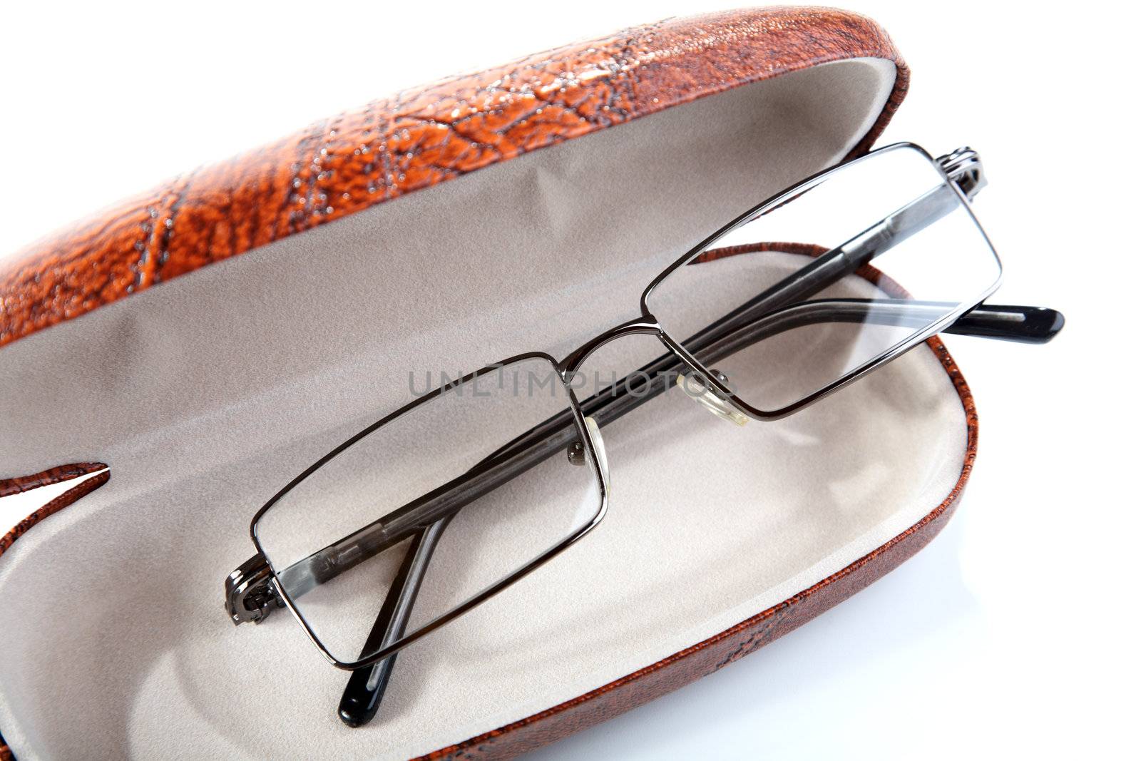 Pair of glasses in a case on a white background