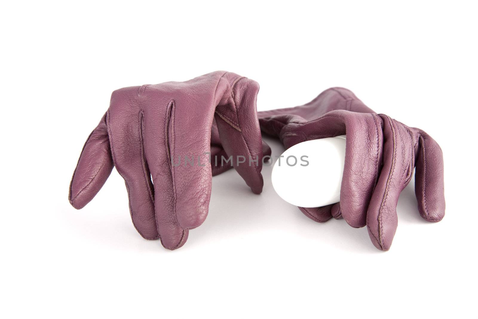 Gloves compress an electric bulb on a white background