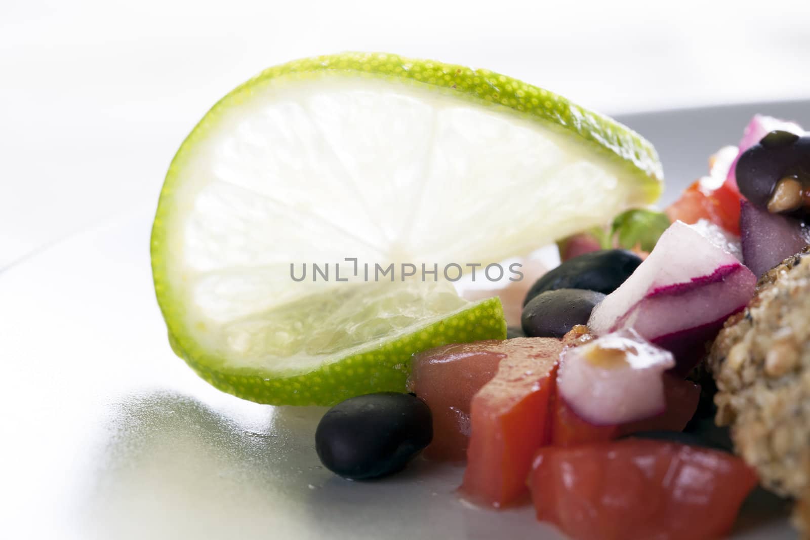 Lime garnish on black bean salsa.