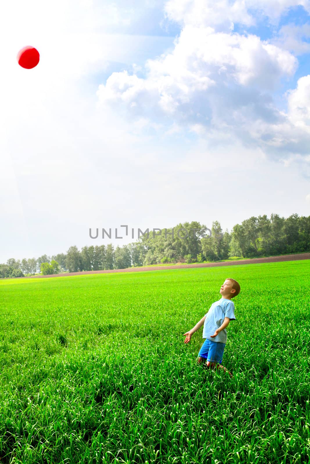 boy play with ball by sabphoto