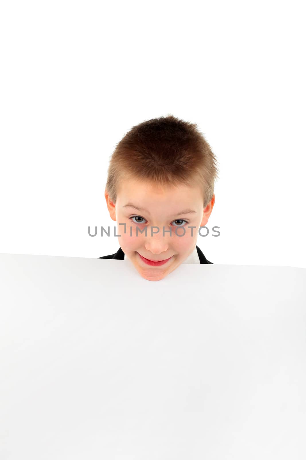 cheerful boy face with blank paper closeup isolated on the white