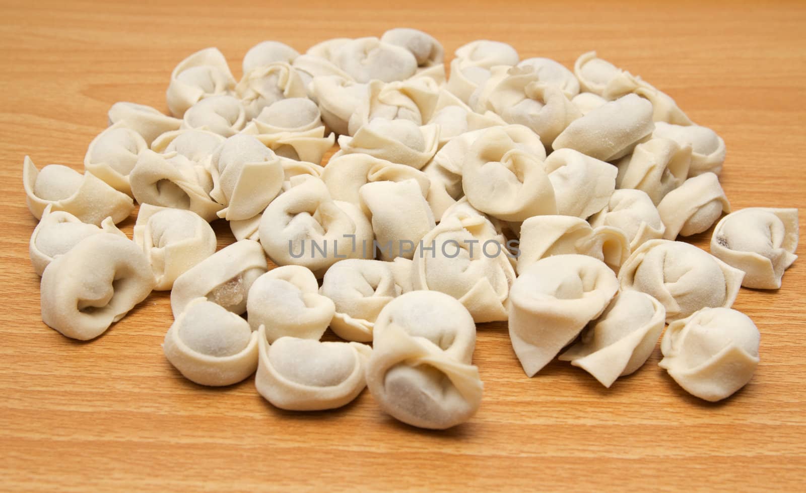 homemade meat dumplings on a cutting board 