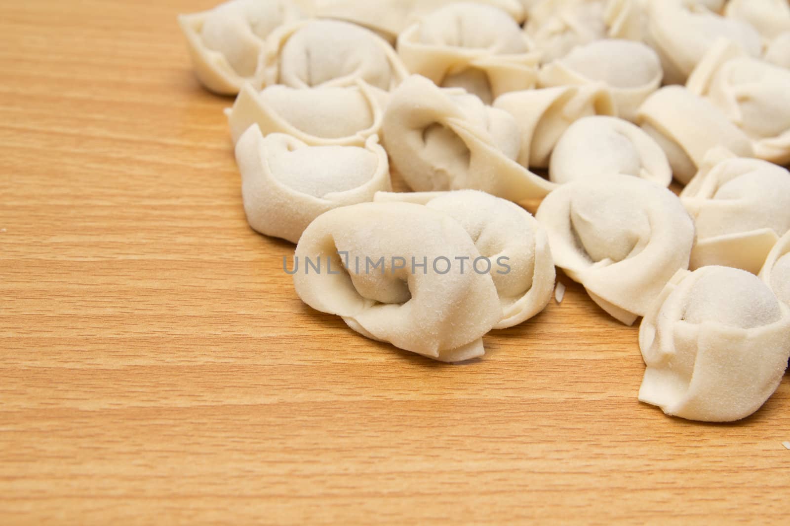 homemade meat dumplings on a cutting board 