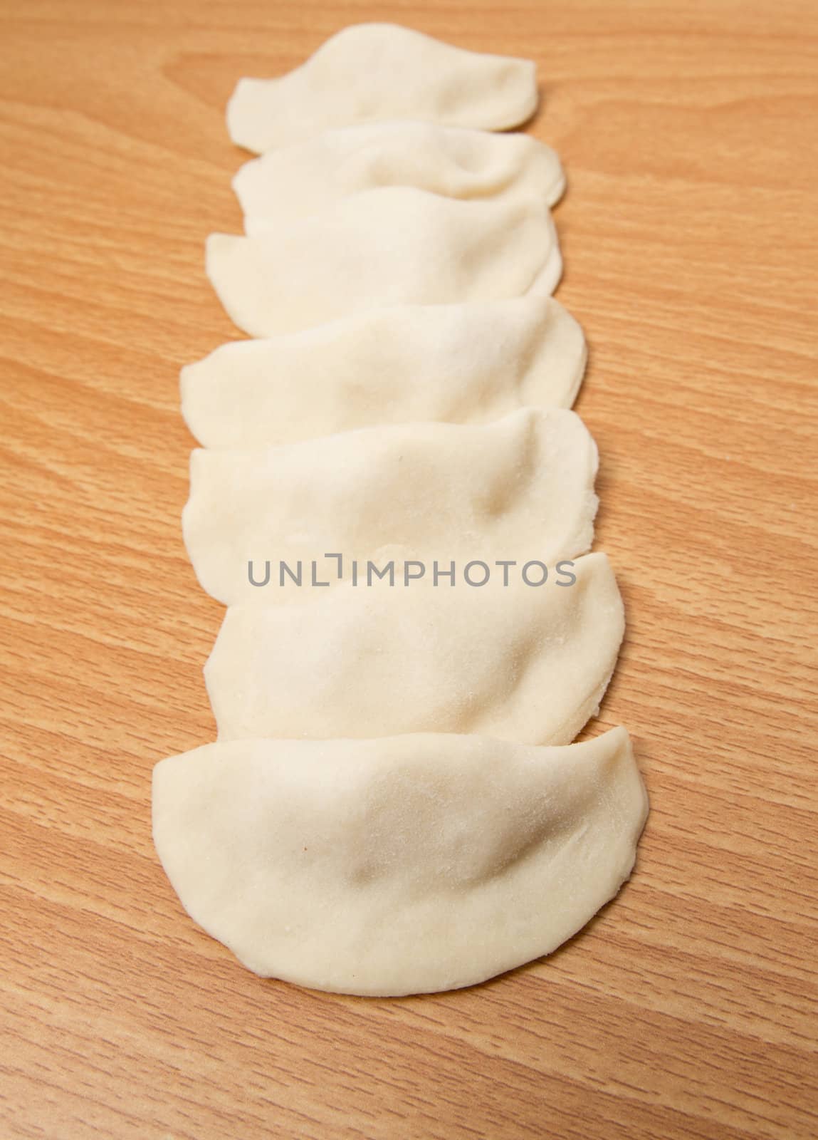 homemade meat dumplings on a cutting board 