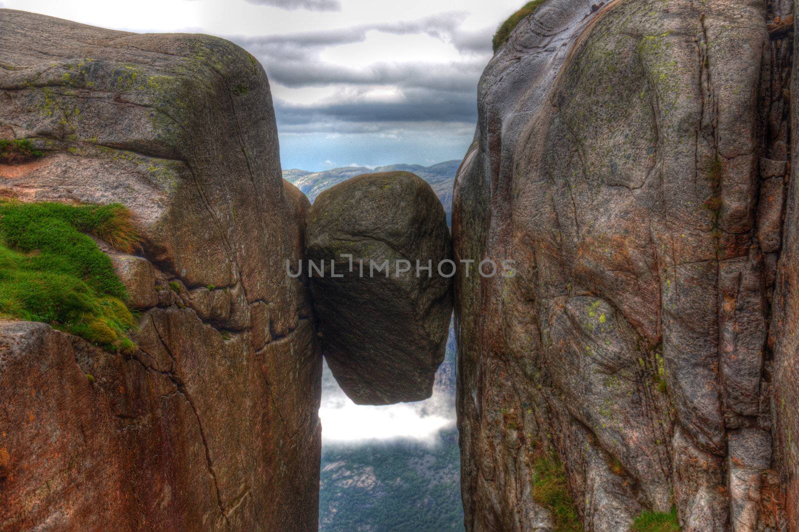 Kjeragbolten Norway the biggest stone between 2 rocks Kjerag Norge HDR