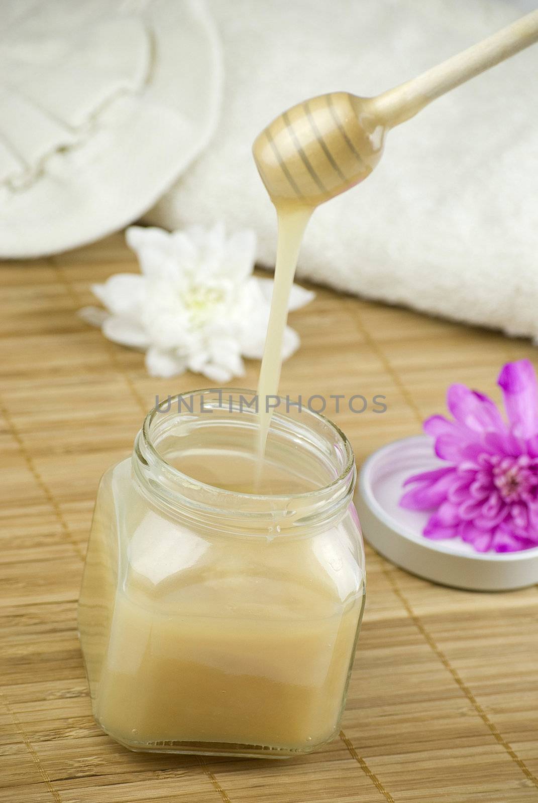 relaxing aroma of almond coconut vanilla milk and honey bath foam over wooden mat