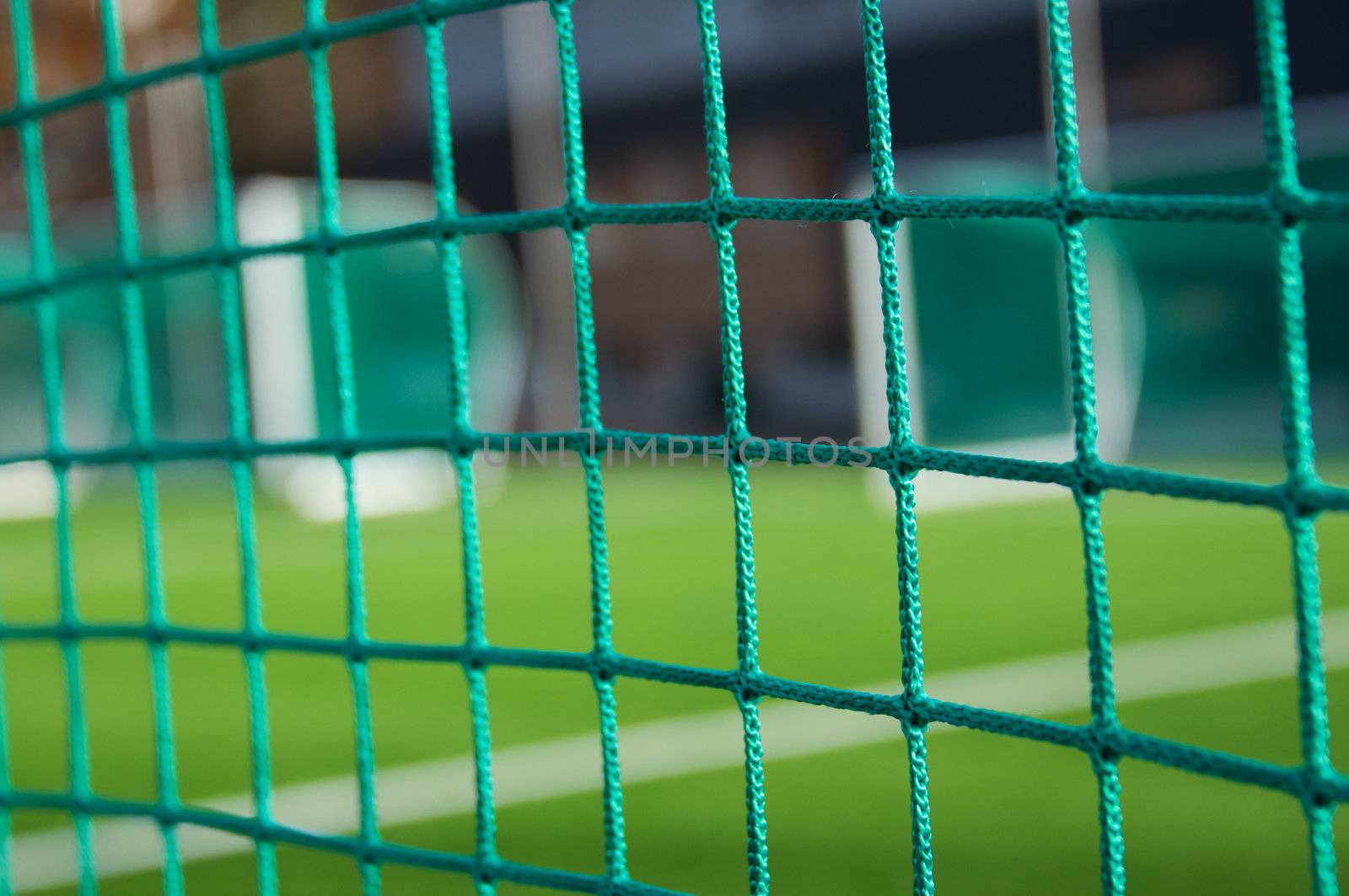 Mesh and white line on football goals background