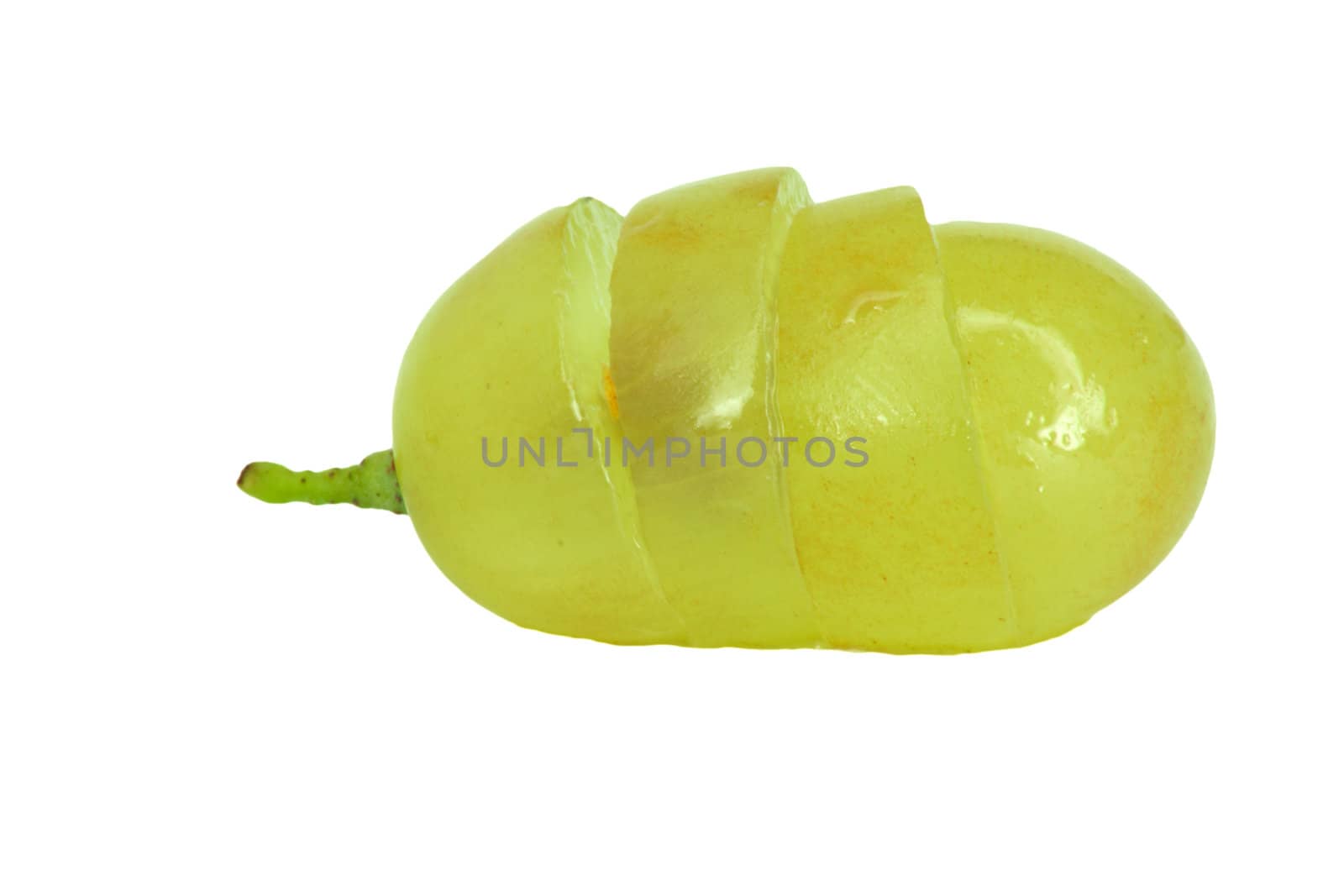 Translucent slice of green grape fruit, macro isolated on white 