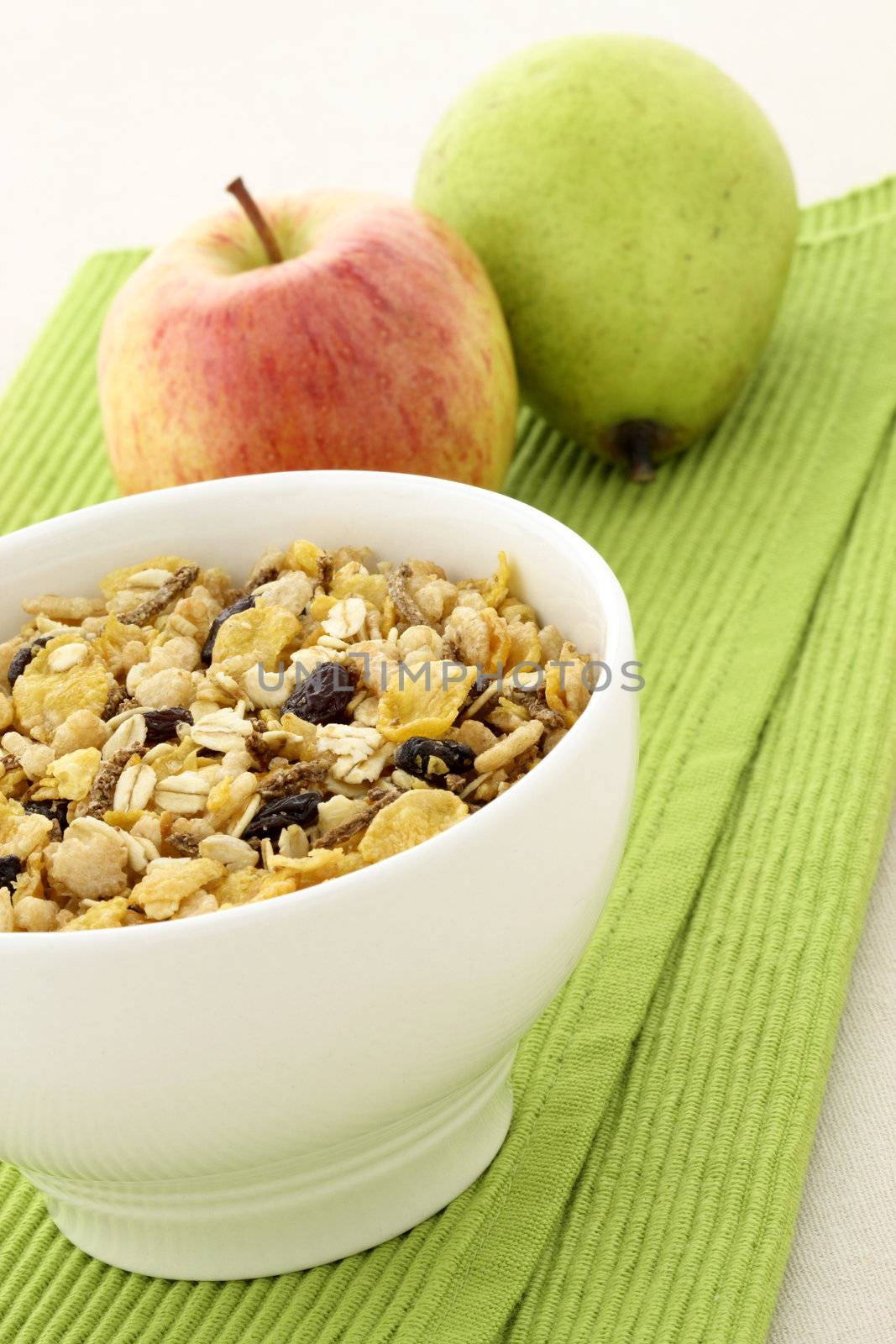 delicious and healthy granola or muesli with fresh organic apple and pear , with lots of dry fruits, nuts and grains. 