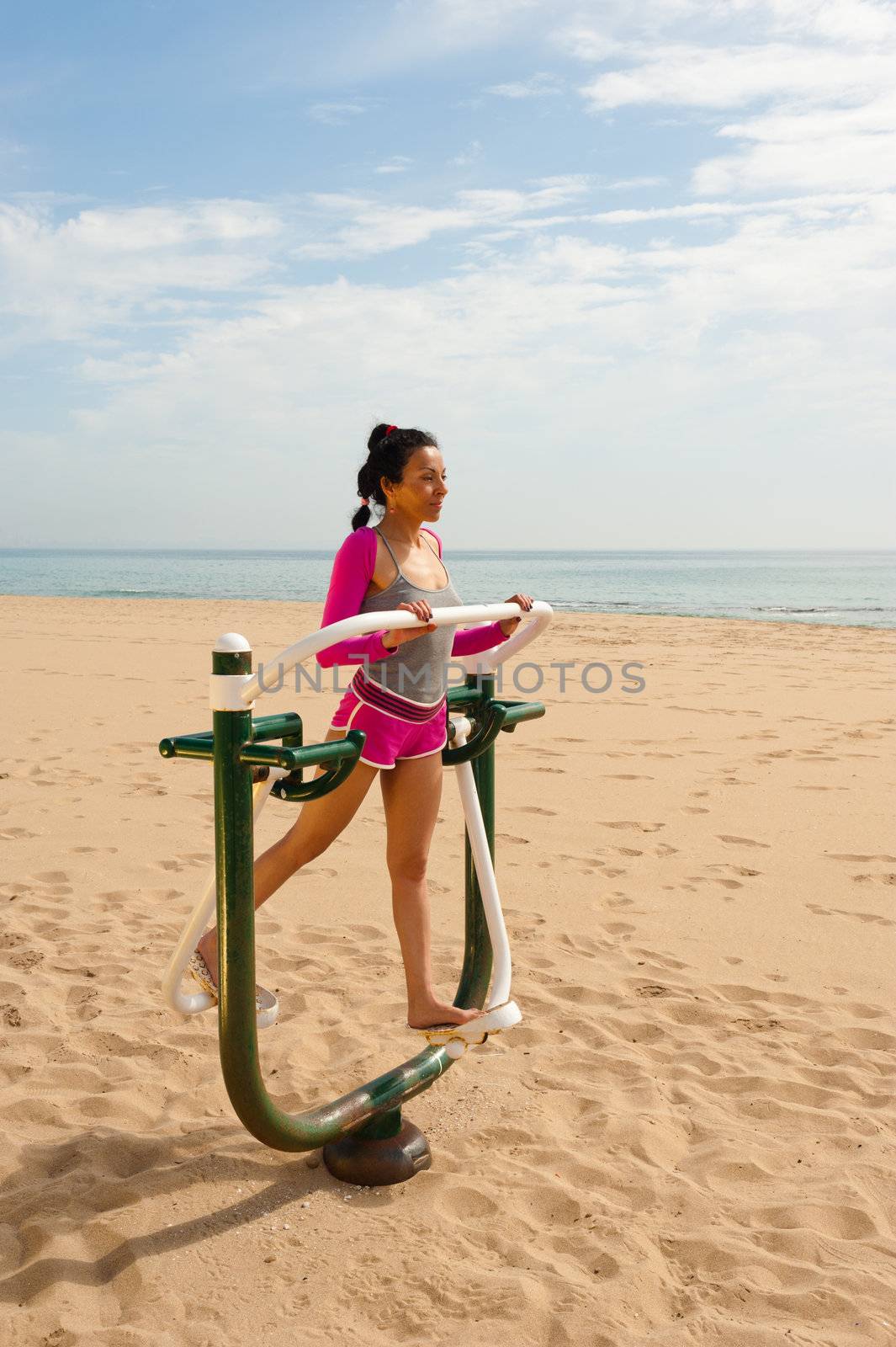 Fitness machine on beach by hemeroskopion