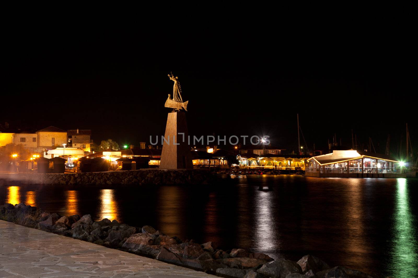 Statue at the entrance of Old Nessebar, night view 