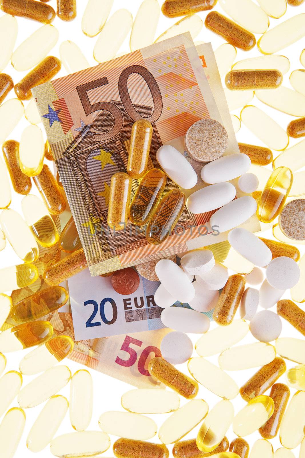 Pills and the euro on a white background