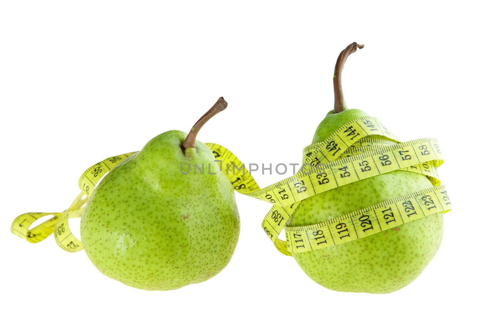 Ripe green pear with measuring tape