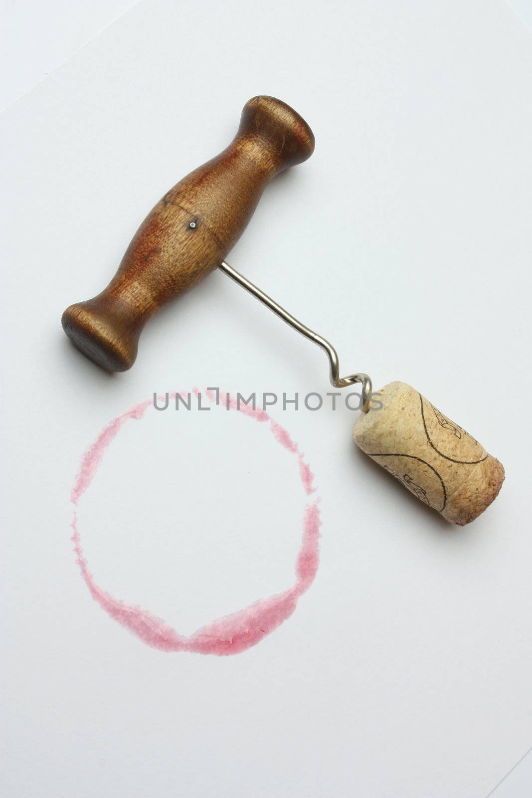 corkscrew and cork on a white background