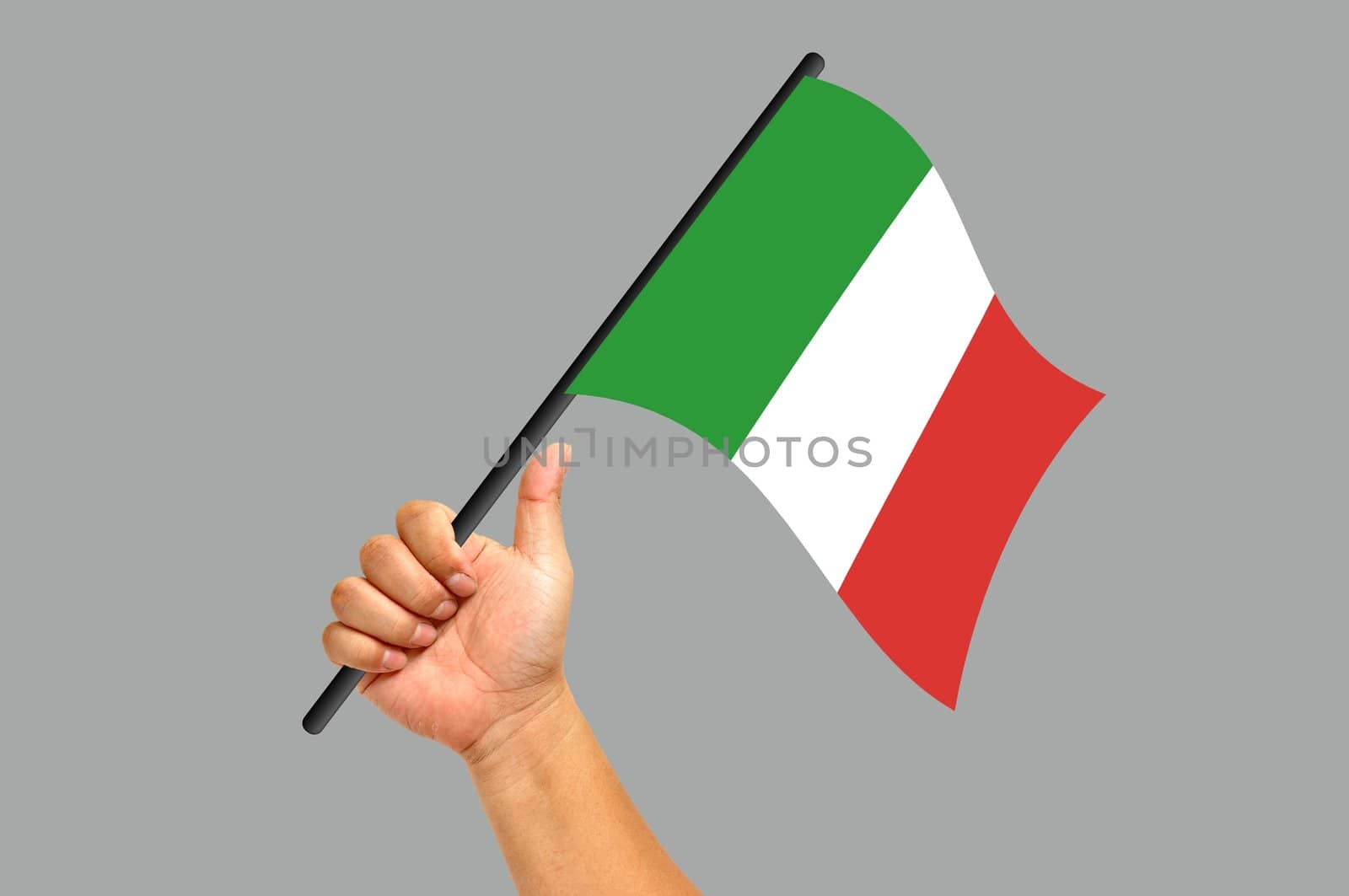 Hand holding Italy flag isolated on white background