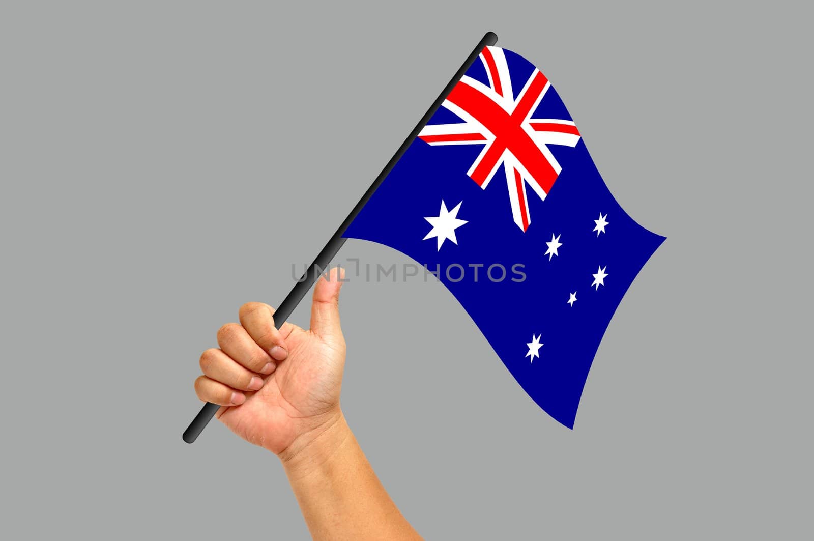 Hand holding australiaflag isolated on white background