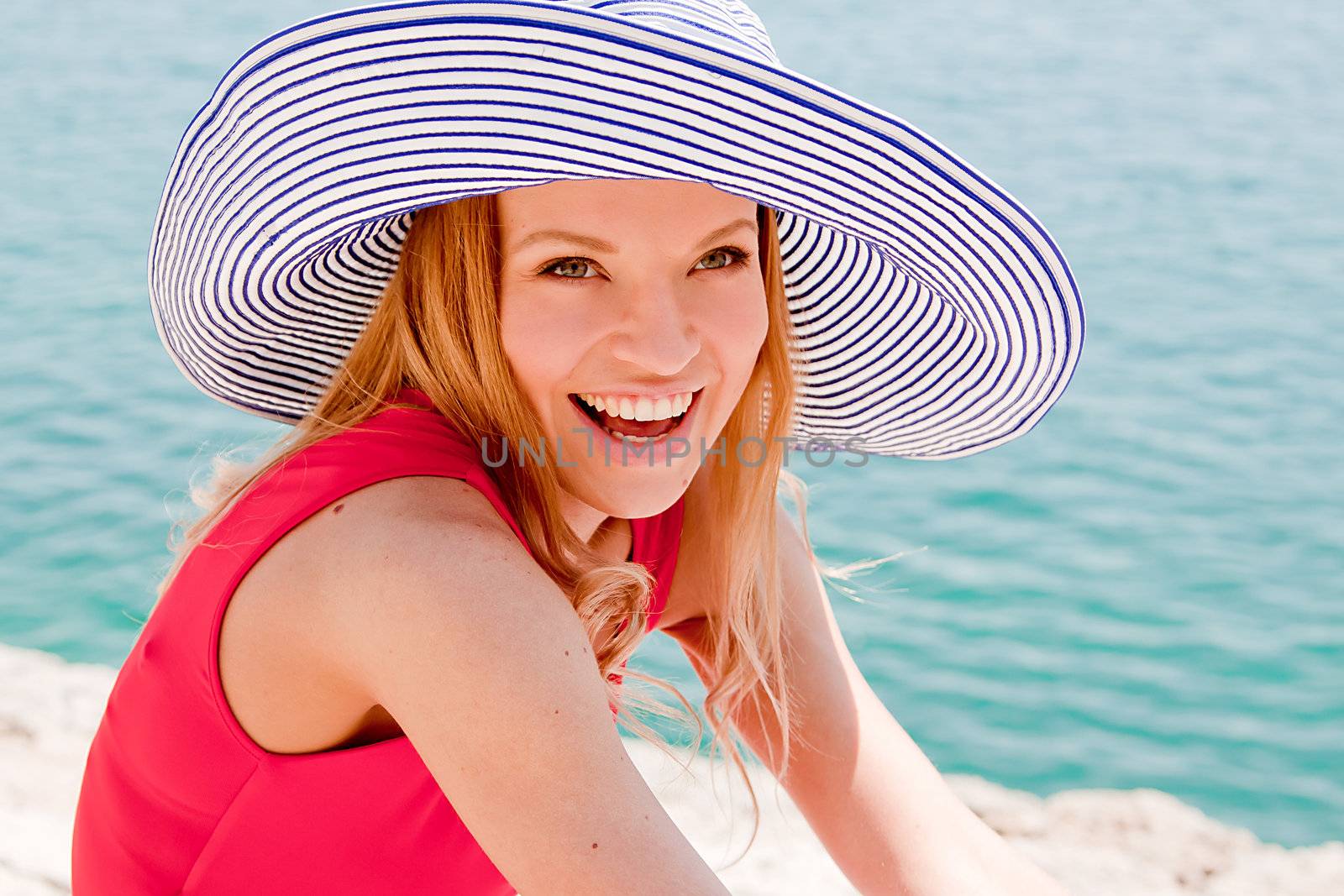 portrait of a beautiful young girl who rests on the coast