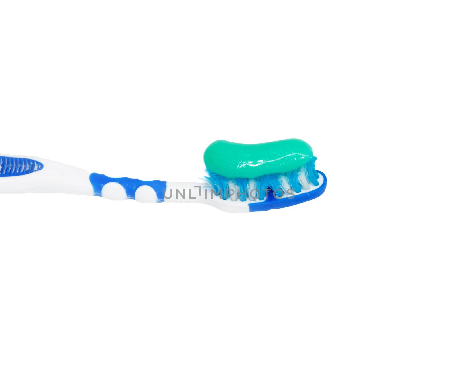 Toothbrush with toothpaste isolated on white background  by schankz