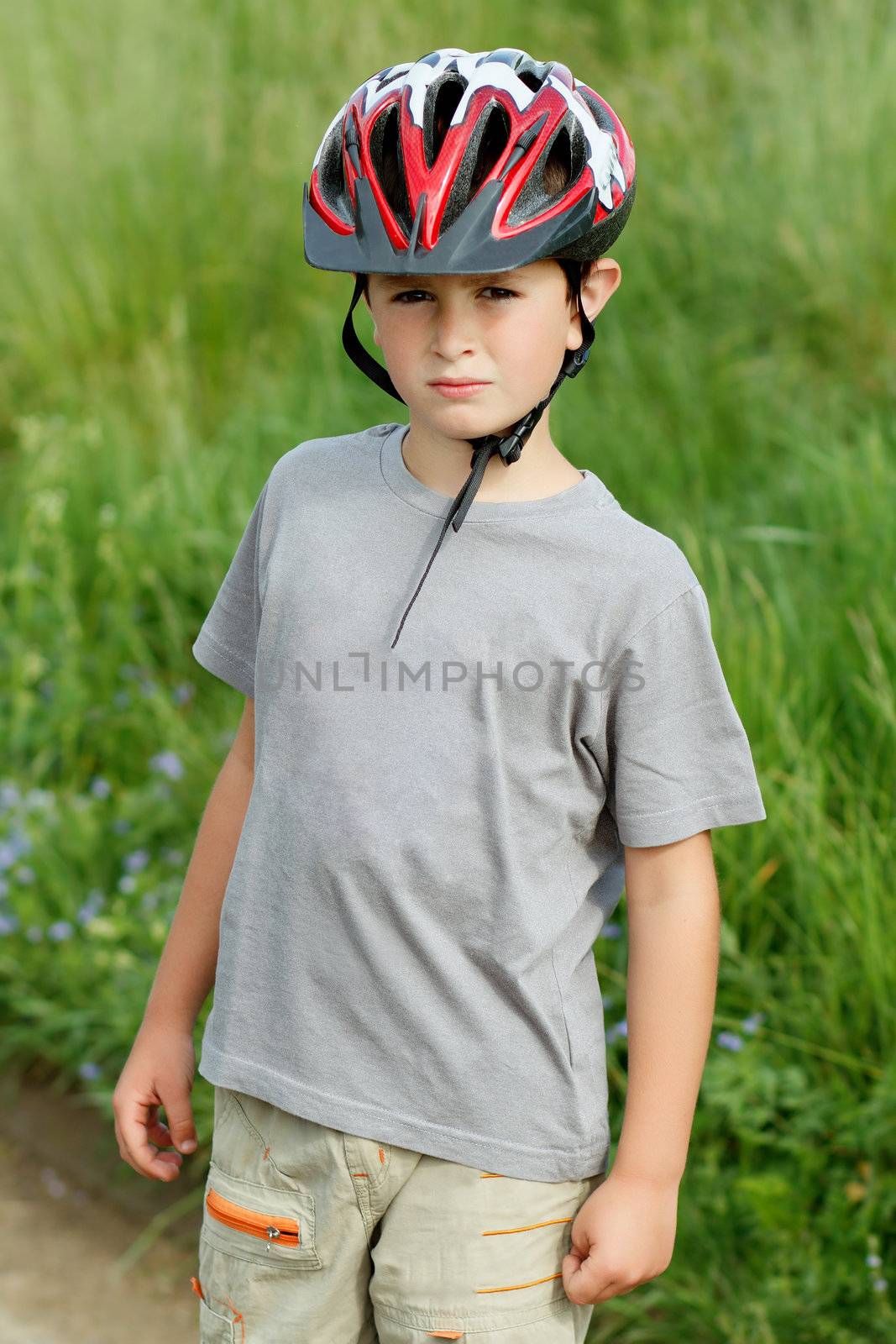 portrait of boy bicyclist with helmet by artush