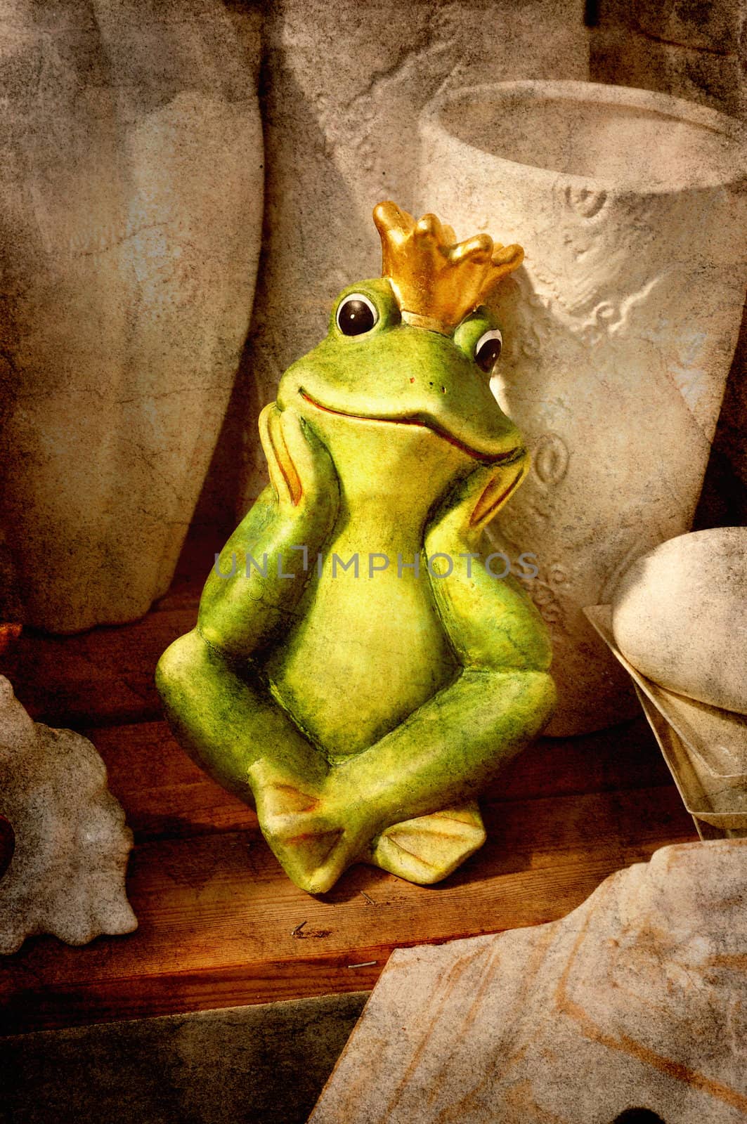 Frog prince sitting on a wooden shelf among vintage garden pots.