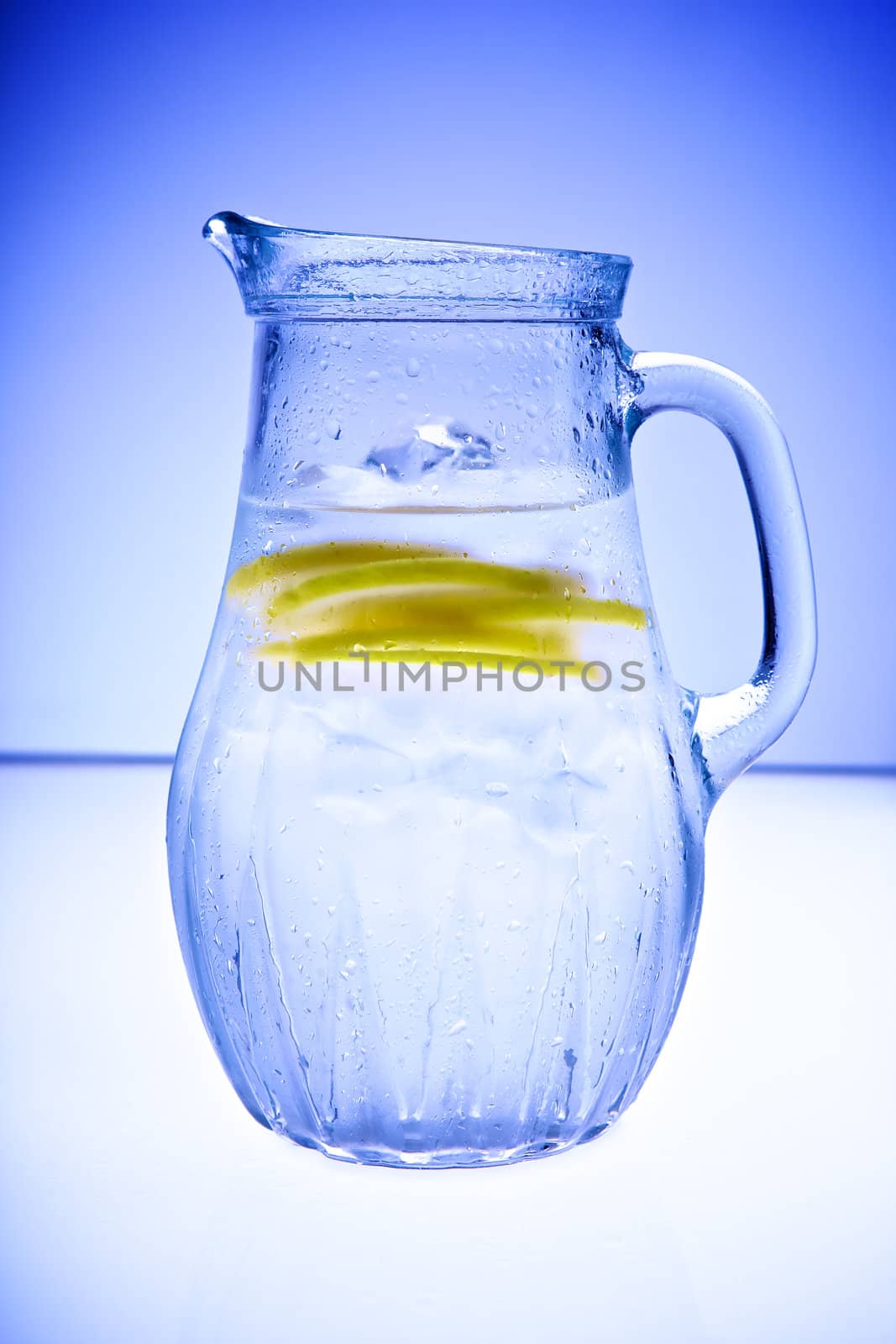 Cold drink with ice and lemon slice