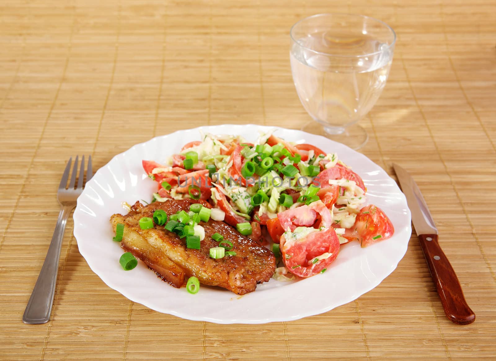 Fried meat with vegetable garnish