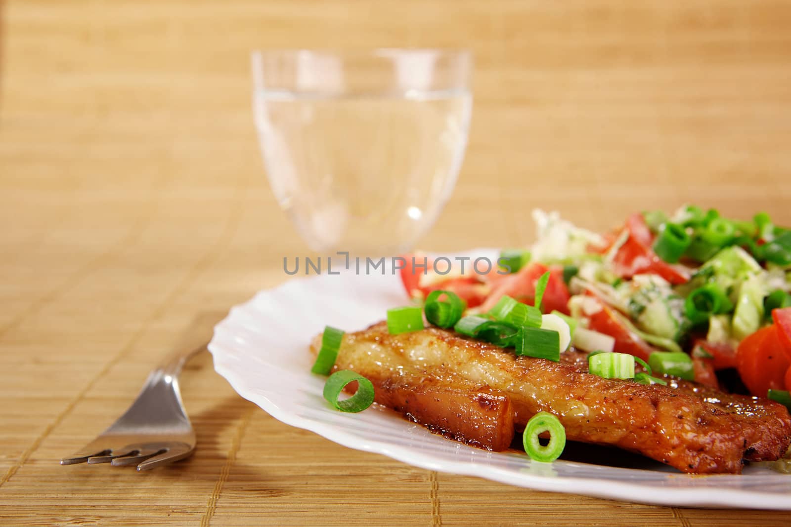 Fried meat with vegetable garnish