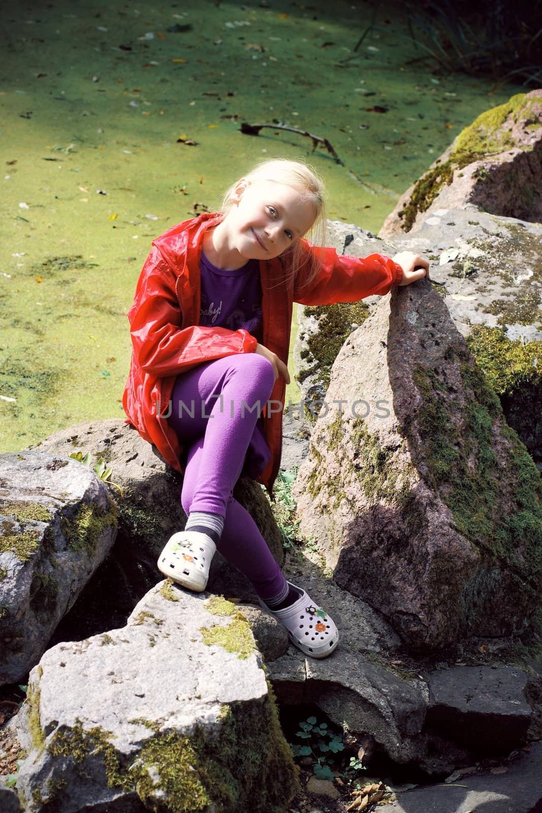 Portrait of Little Girl in Autumn Park