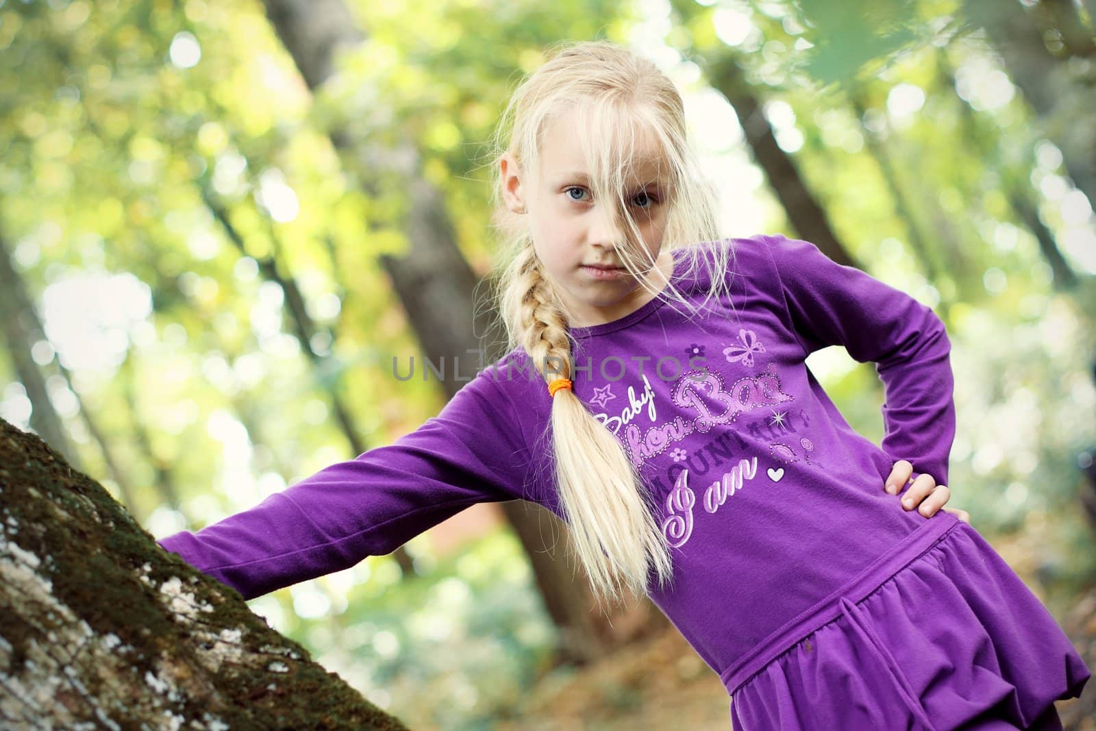 Portrait of Little Girl in Autumn Park