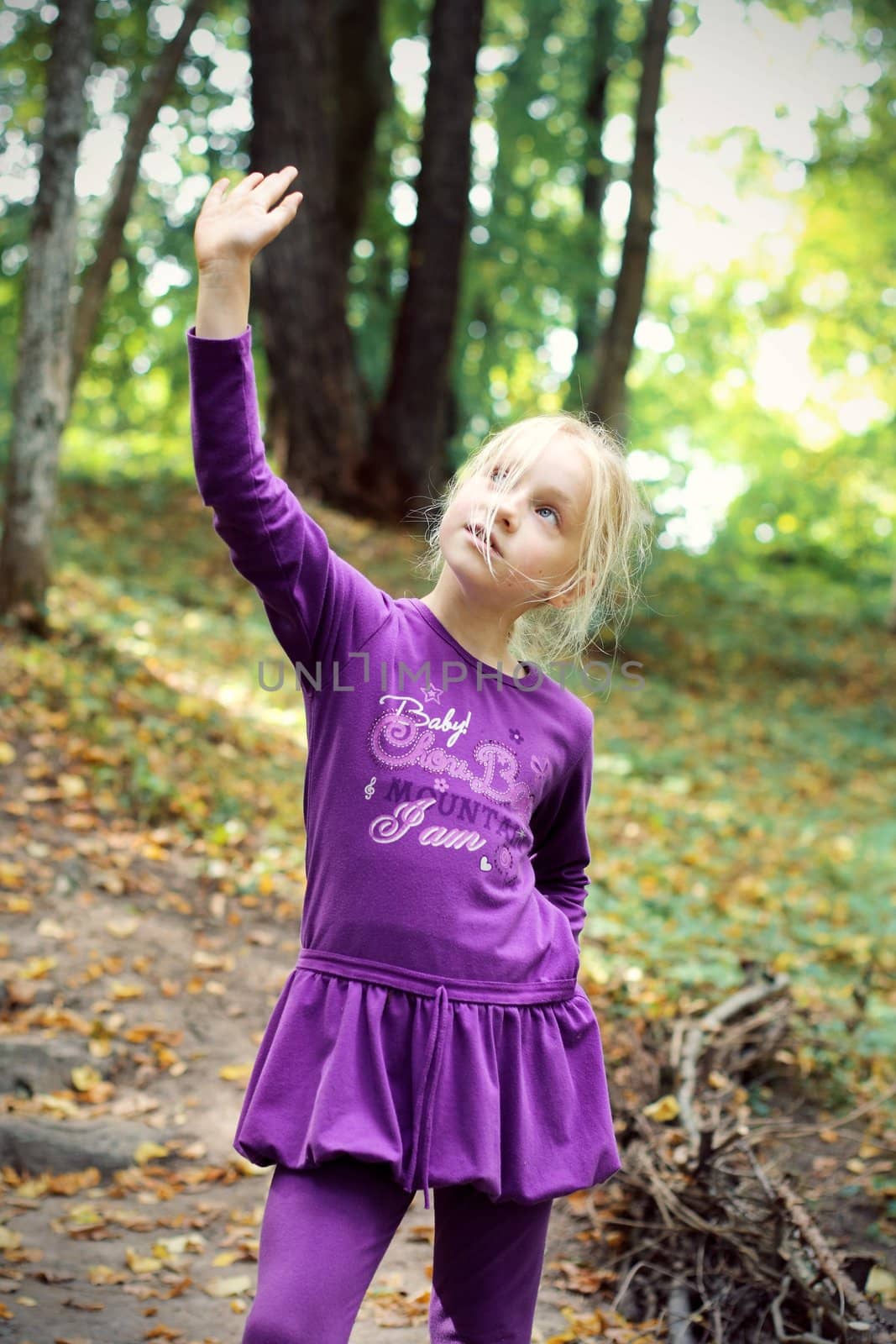 Portrait of Little Girl in Autumn Park